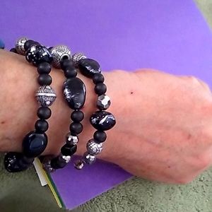 Triple twist arm bracelet with silvery beads